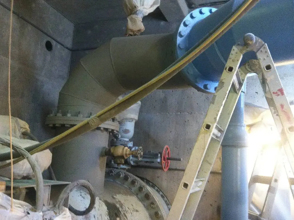 A view of pipes and valves from above.